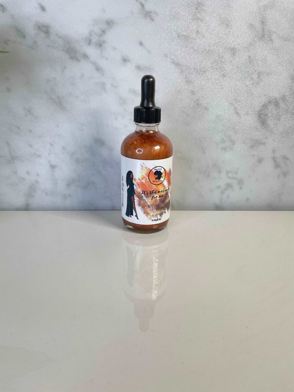 It's the Melanin for Me Shimmer Body Oil