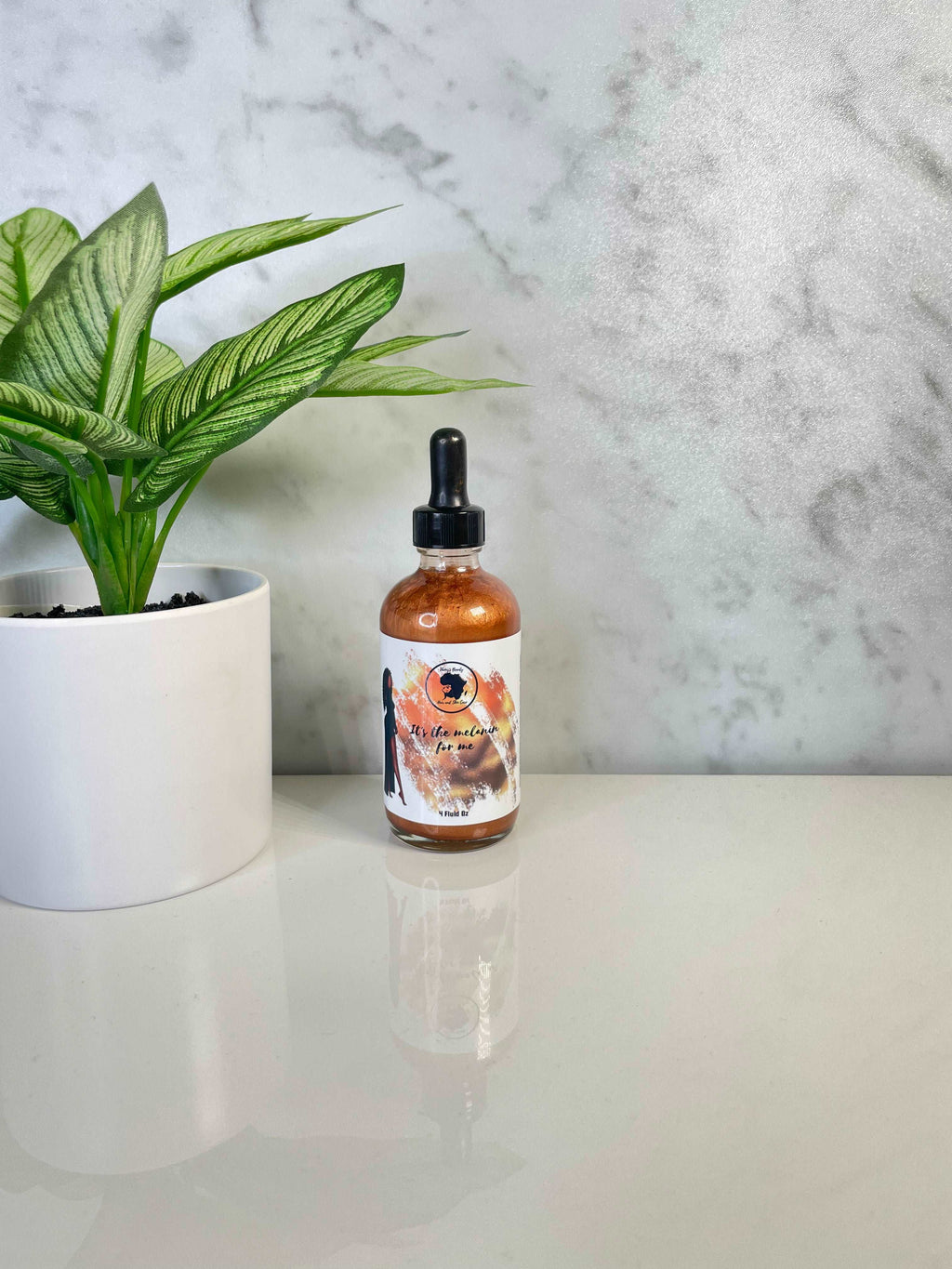 It's the Melanin for Me Shimmer Body Oil